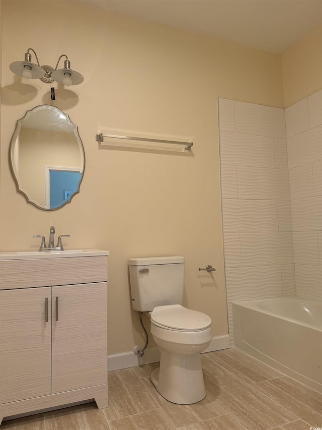 full bathroom featuring bathing tub / shower combination, vanity, wood-type flooring, and toilet