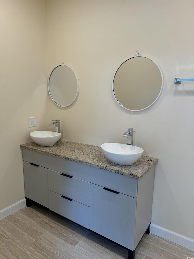 bathroom featuring vanity and wood-type flooring