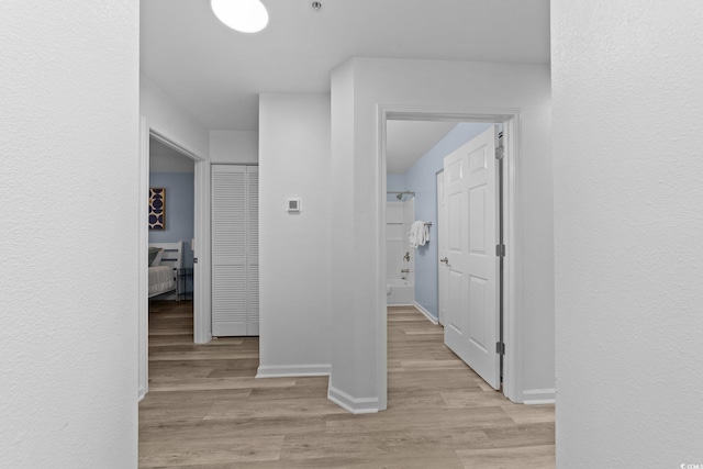 corridor featuring light wood-type flooring