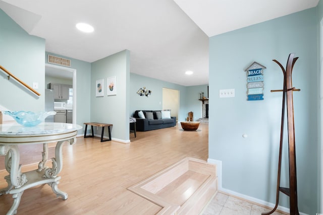 hall featuring light hardwood / wood-style floors