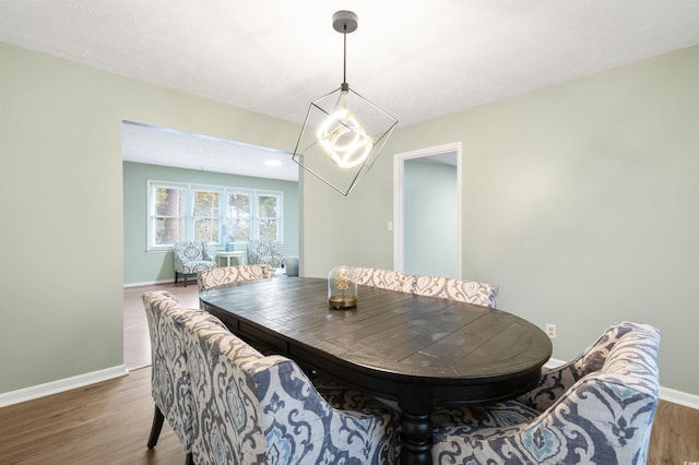 dining space featuring dark hardwood / wood-style floors