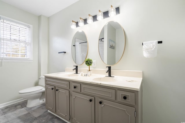 bathroom with vanity and toilet