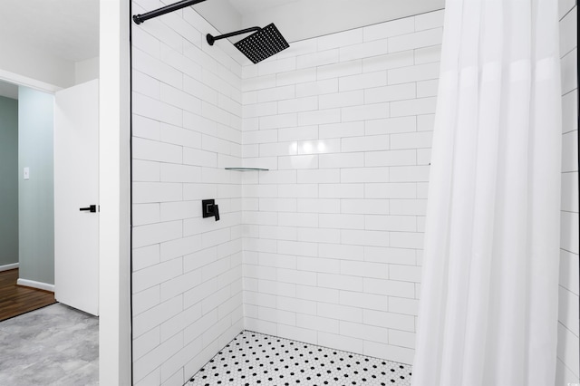 bathroom featuring a shower with curtain and hardwood / wood-style flooring