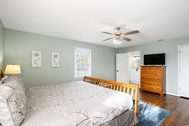 bedroom featuring ensuite bathroom, ceiling fan, and dark hardwood / wood-style flooring