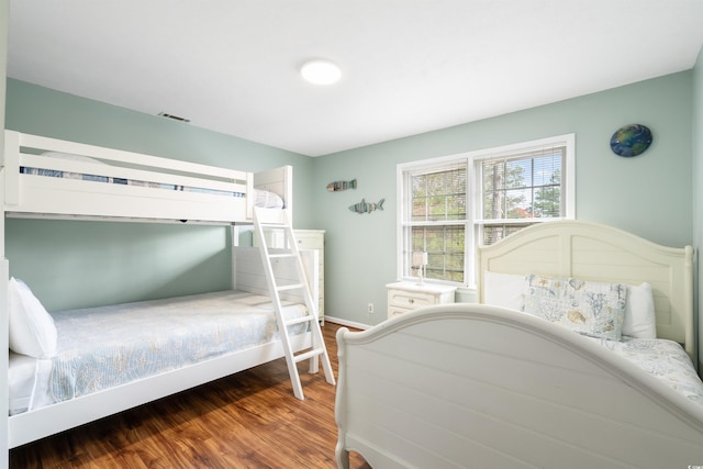 bedroom featuring dark wood-type flooring