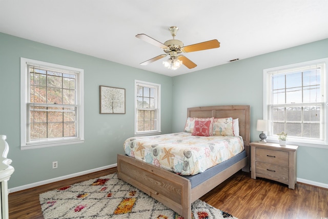 bedroom featuring dark hardwood / wood-style floors and ceiling fan