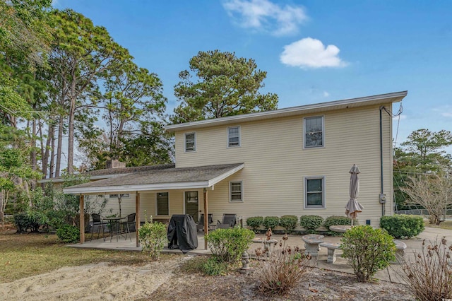 back of property featuring a patio area