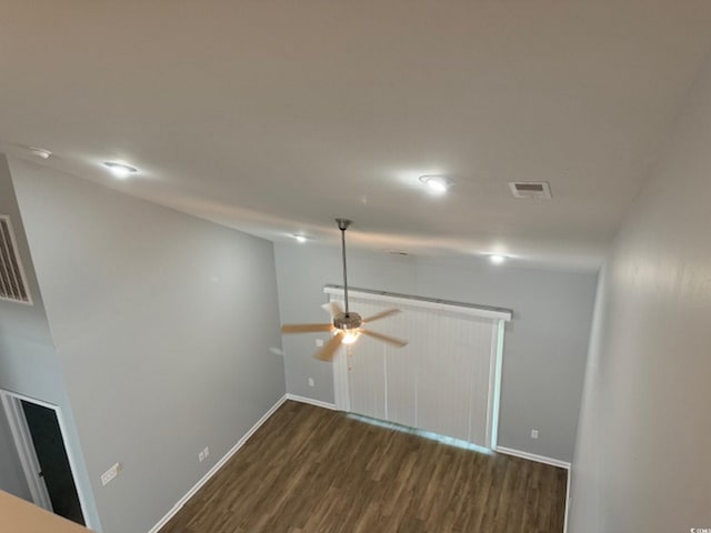 empty room with dark hardwood / wood-style flooring