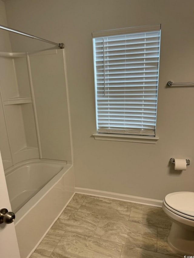 bathroom with shower / tub combination and toilet