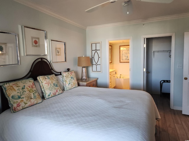 bedroom featuring connected bathroom, ceiling fan, dark hardwood / wood-style flooring, crown molding, and a closet