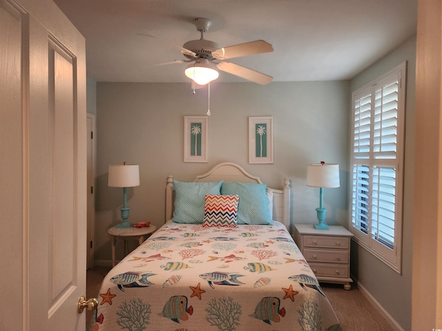 bedroom with ceiling fan and carpet floors