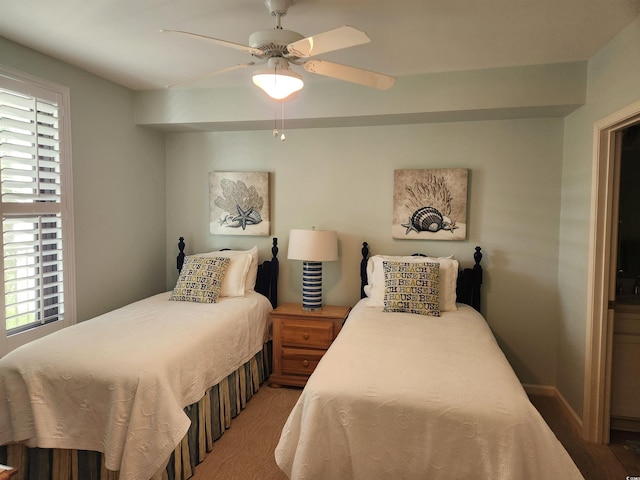 bedroom with multiple windows and ceiling fan