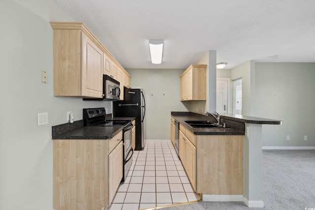 8830 Chandler Dr Unit E, Myrtle Beach, SC 29575 - kitchen with light brown cabinets, electric range oven, a sink, stainless steel microwave, and dishwashing machine