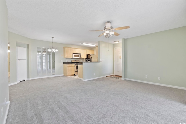 8830 Chandler Dr Unit E, Myrtle Beach, SC 29575 - unfurnished living room with a chandelier, ceiling fan, light carpet, baseboards, and a textured ceiling