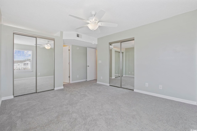 8830 Chandler Dr Unit E, Myrtle Beach, SC 29575 - unfurnished bedroom featuring multiple closets, carpet, and baseboards