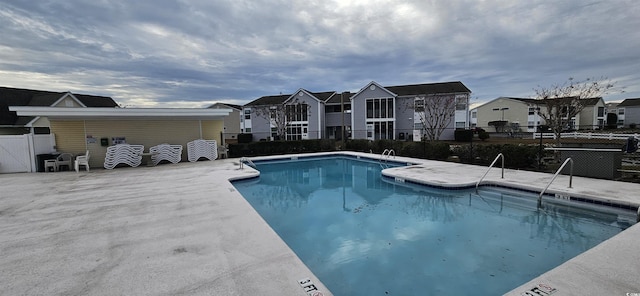 8830 Chandler Dr Unit E, Myrtle Beach, SC 29575 - community pool featuring fence, a residential view, and a patio