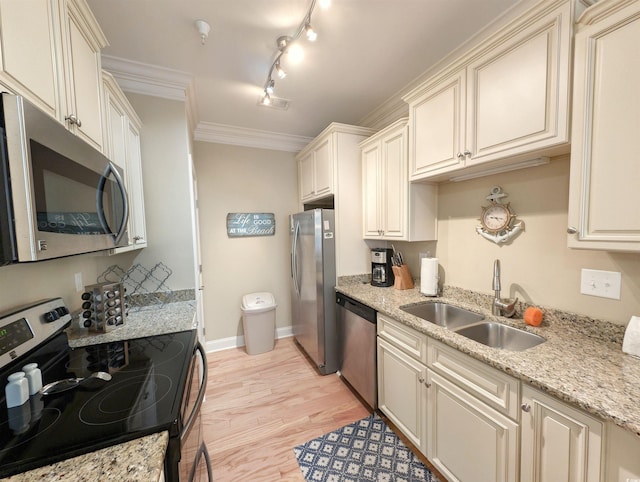 kitchen featuring light stone countertops, sink, stainless steel appliances, crown molding, and light hardwood / wood-style floors