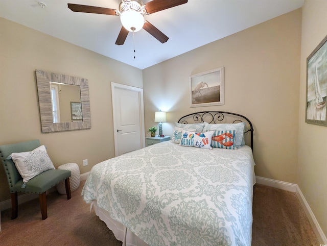 bedroom featuring ceiling fan and dark carpet