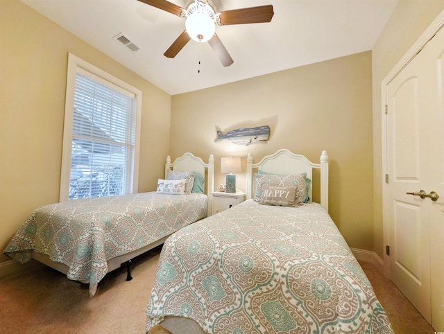 carpeted bedroom with ceiling fan