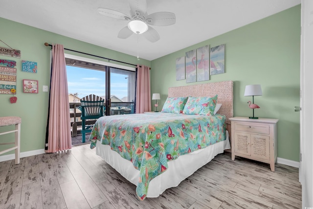 bedroom featuring ceiling fan, access to exterior, and light hardwood / wood-style flooring