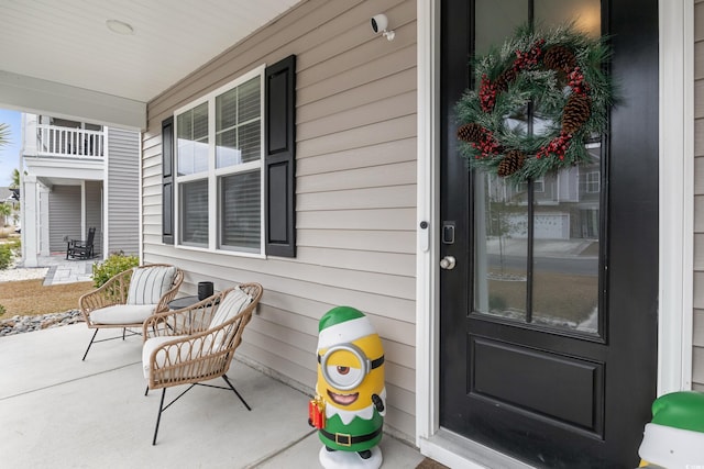 view of exterior entry featuring a porch