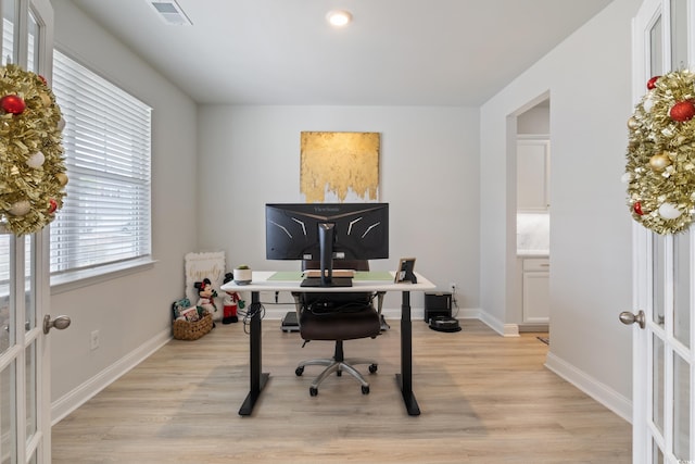 office featuring french doors and light wood-type flooring