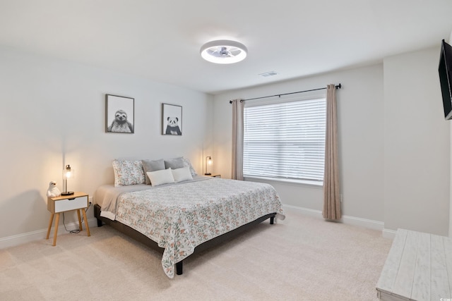 bedroom with light colored carpet