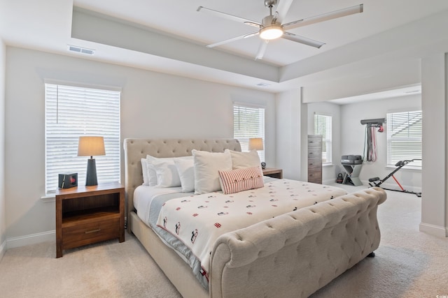 bedroom with light colored carpet and ceiling fan