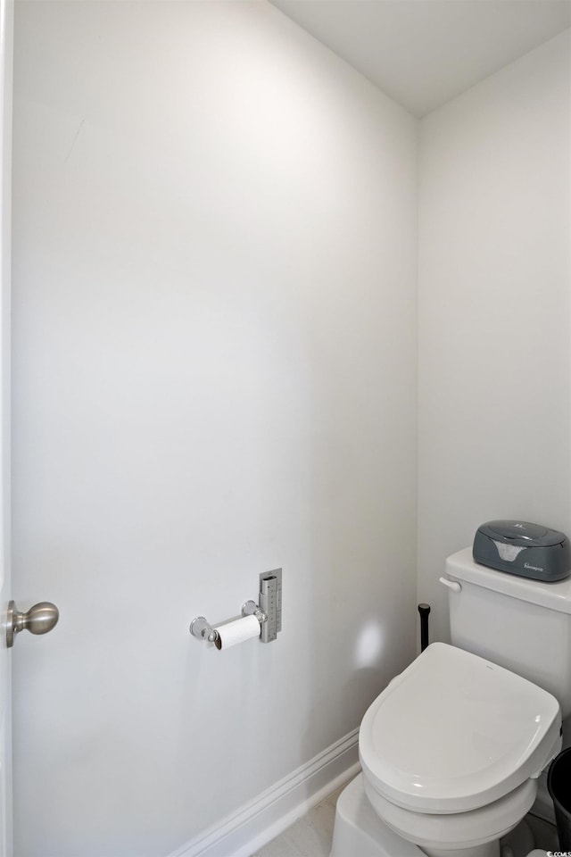 bathroom with tile patterned floors and toilet