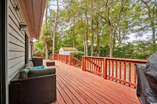 wooden terrace featuring grilling area and outdoor lounge area