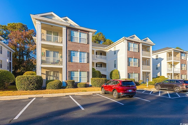 1310 River Oaks Dr Unit 2J, Myrtle Beach, SC 29579 - view of apartment building / complex featuring uncovered parking