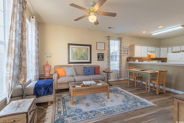 living room with recessed lighting, wood finished floors, visible vents, a ceiling fan, and baseboards