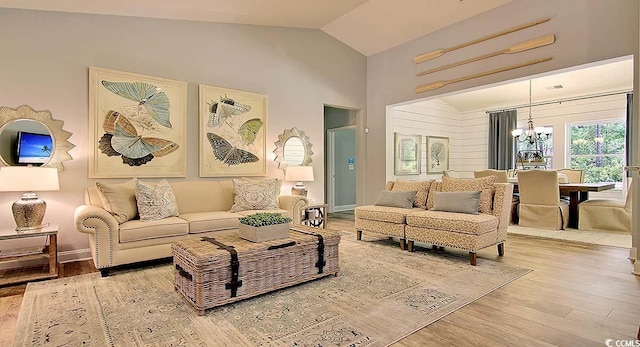 2038 Lone Cypress Dr, Myrtle Beach, SC 29579 - living room featuring hardwood / wood-style flooring, high vaulted ceiling, and a chandelier