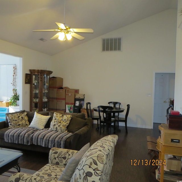 living room with ceiling fan, dark hardwood / wood-style floors, and lofted ceiling