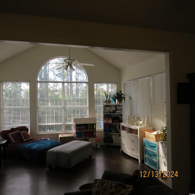 sitting room featuring vaulted ceiling with beams, ceiling fan, and dark hardwood / wood-style floors