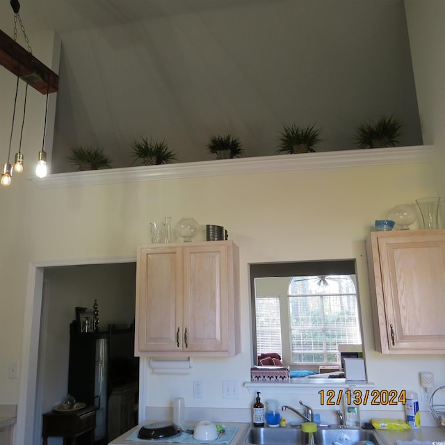 kitchen featuring light brown cabinets and sink