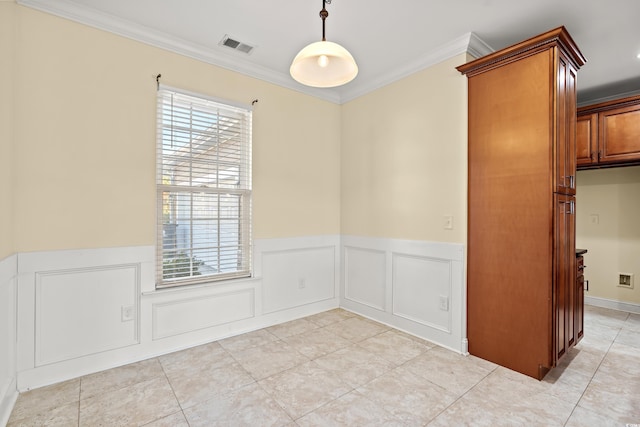 tiled spare room with crown molding and a healthy amount of sunlight