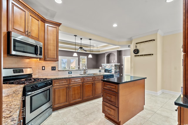 kitchen featuring dark stone counters, french doors, sink, crown molding, and appliances with stainless steel finishes