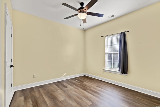 empty room featuring hardwood / wood-style flooring and ceiling fan