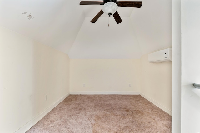 carpeted empty room featuring vaulted ceiling, an AC wall unit, and ceiling fan