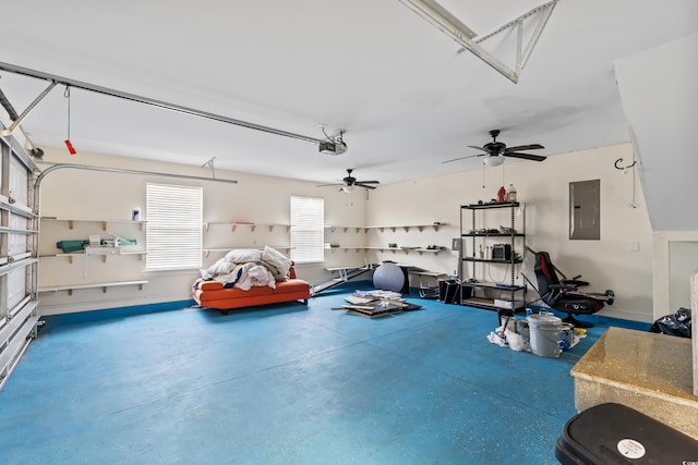 garage with ceiling fan, a garage door opener, and electric panel