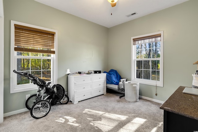 carpeted bedroom with ceiling fan