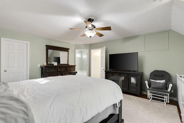 bedroom with light colored carpet, ceiling fan, and lofted ceiling