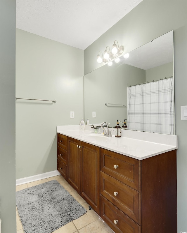 bathroom featuring tile patterned floors and vanity