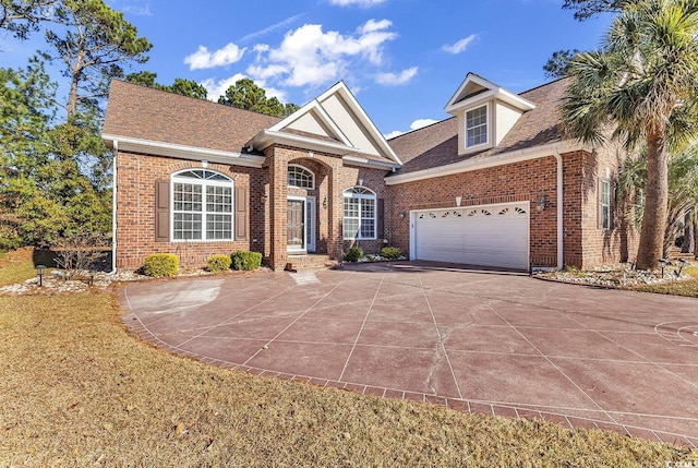 5603 Leatherleaf Dr, North Myrtle Beach, SC 29582 - view of front of property featuring brick siding, a garage, concrete driveway, and a shingled roof