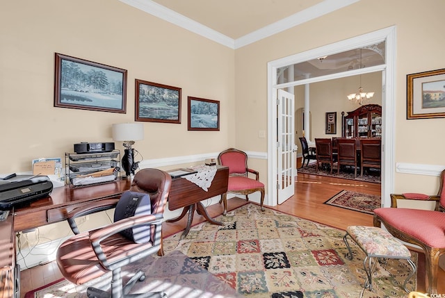 office space with a chandelier, wood-type flooring, french doors, and crown molding