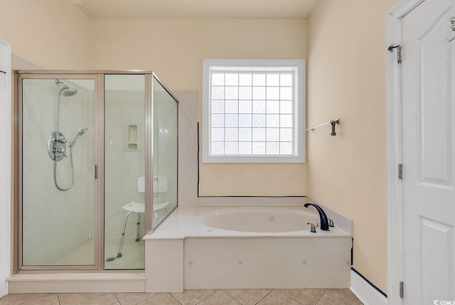 bathroom with shower with separate bathtub and tile patterned floors