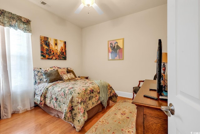 bedroom with hardwood / wood-style flooring and ceiling fan