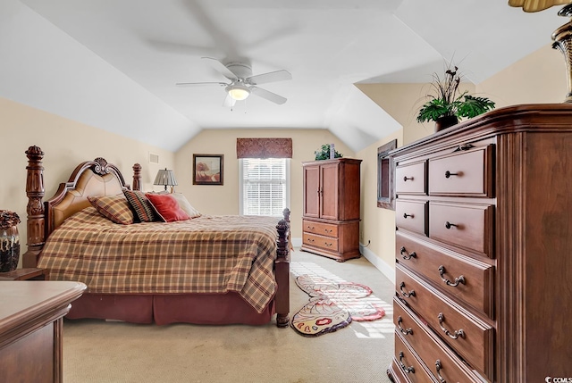 carpeted bedroom featuring vaulted ceiling and ceiling fan