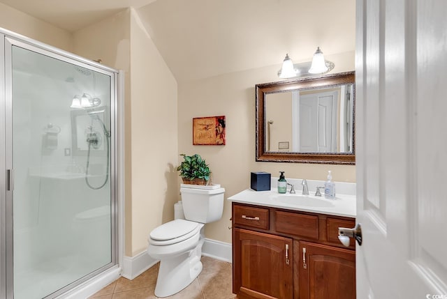 bathroom with tile patterned floors, vanity, toilet, and an enclosed shower